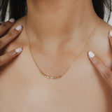 Collana Whisper Mezza Luna in Oro Giallo con Punti Luce di Diamanti