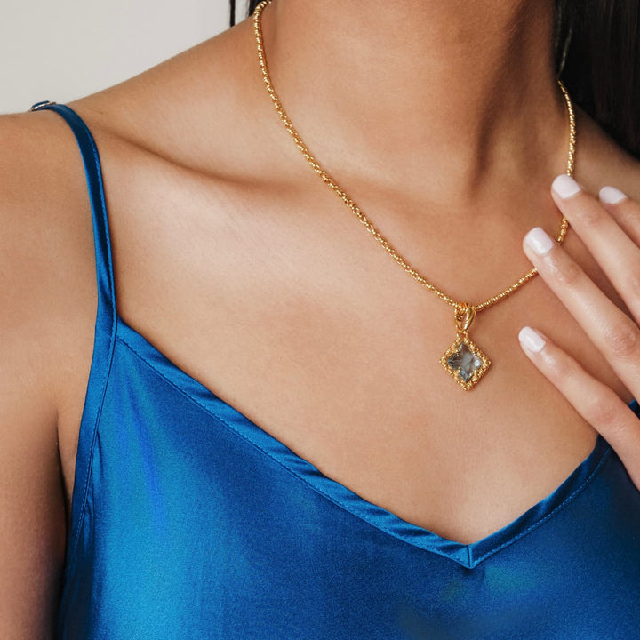 Pendente Quadra in Oro con Topazio Azzurro